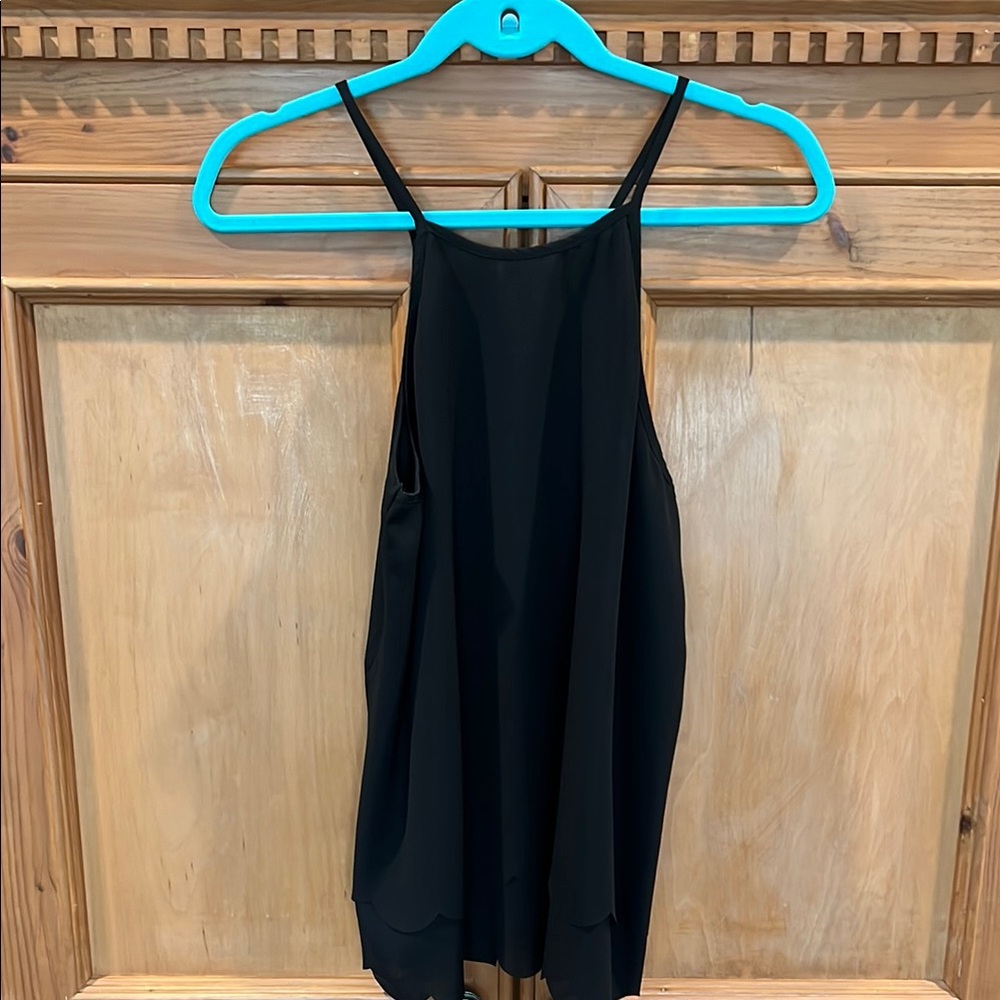 Emmelee Black Sleeveless Top scalloped hem and scalloped overlay in the back